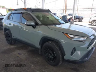 2023 Toyota RAV4 Hybrid XLE Premium z VIN JTMB6RFV4PD097043, wystawiony jako IAAI lot #42221684 z przebiegiem 72 433 mil mil oraz . Historia ofert i sprzedaży dostępna na DreamBid. Obrazek 1.