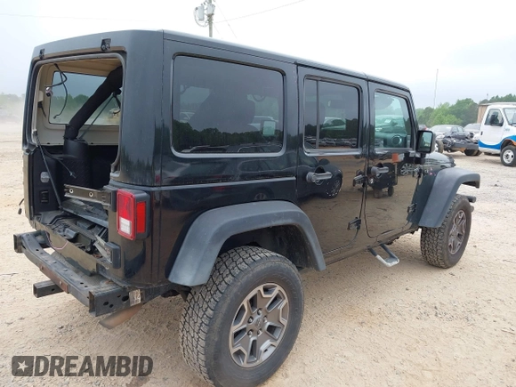 2015 Jeep Wrangler Unlimited Rubicon with VIN 1C4BJWFG7FL688728, listed as a IAAI auction lot 42054304 with 100,152 mi miles and . Bid and sale history available at DreamBid. Image 4.