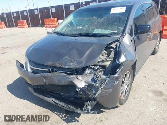 2012 Honda Odyssey EX-L with VIN 5FNRL5H61CB095789, listed as a IAAI auction lot 42065507 with 138,570 mi miles and . Bid and sale history available at DreamBid. Image 6.