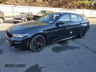 2023 BMW 5 Series M550i xDrive with VIN WBA13BK04PCM46128, listed as a Copart auction lot 70066354 with 12,819 mi miles and Salvage title. Bid and sale history available at DreamBid. Image 1.