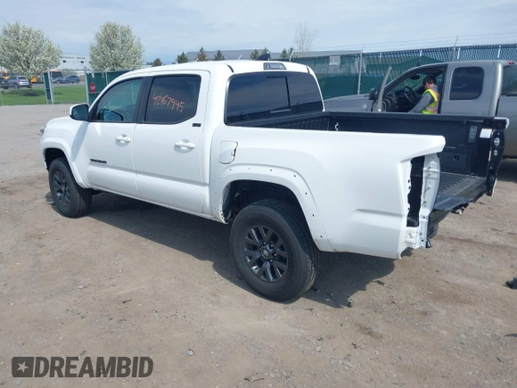 2023 Toyota Tacoma SR with VIN 3TMCZ5AN2PM642205, listed as a IAAI auction lot 42167945 with 10,595 mi miles and . Bid and sale history available at DreamBid. Image 3.