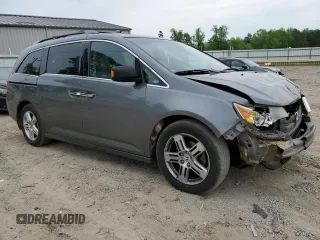 2012 Honda Odyssey Touring with VIN 5FNRL5H96CB045514, listed as a Copart auction lot 54698355 with 217,787 mi miles and Clean Title. Bid and sale history available at DreamBid. Image 4.