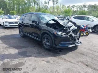2019 Mazda CX-5 Touring with VIN JM3KFACM6K0672294, listed as a IAAI auction lot 42003210 with 50,127 mi miles. Bid and sale history available at carsss.com. Image 1.