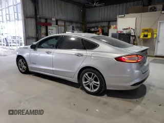 2016 Ford Fusion Titanium Hybrid with VIN 3FA6P0RUXGR355351, listed as a Copart auction lot 56516025 with 117,964 mi miles and Salvage title. Bid and sale history available at DreamBid. Image 2.
