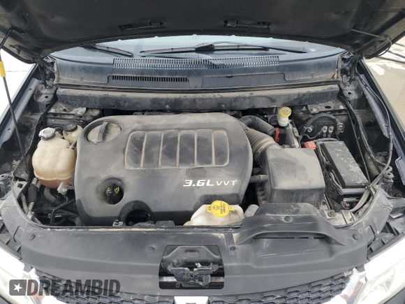 2015 Dodge Journey SXT with VIN 3C4PDDBG0FT660457, listed as a Copart auction lot 54582265 with 164,879 mi miles and Salvage title. Bid and sale history available at DreamBid. Image 12.