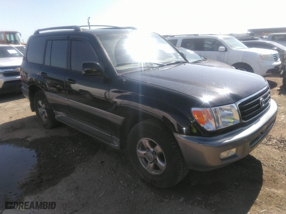 2001 Toyota Land Cruiser with VIN JTEHT05J512016563, listed as a IAAI auction lot 41868193 with 247,653 mi miles. Bid and sale history available at carsss.com. Image 1.