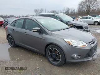 2012 Ford Focus SE with VIN 1FAHP3F21CL415006, listed as a IAAI auction lot 42073643 with 168,516 mi miles. Bid and sale history available at carsss.com. Image 1.