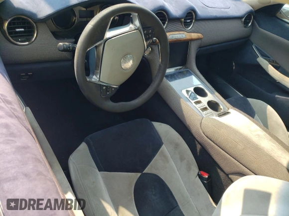 2012 Fisker Karma EcoChic z VIN YH4K16AA7CA000341, wystawiony jako Copart lot #62492854 z przebiegiem Nie podano mil oraz Szkody całkowita. Historia ofert i sprzedaży dostępna na DreamBid. Obrazek 8.