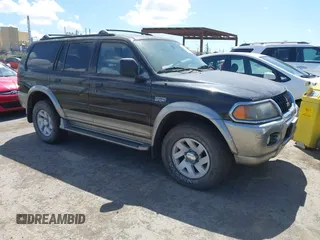 2000 Mitsubishi Montero LS z VIN JA4MT31H6YP803889, wystawiony jako IAAI lot #42206580 z przebiegiem 83 543 mil mil oraz . Historia ofert i sprzedaży dostępna na DreamBid. Obrazek 1.