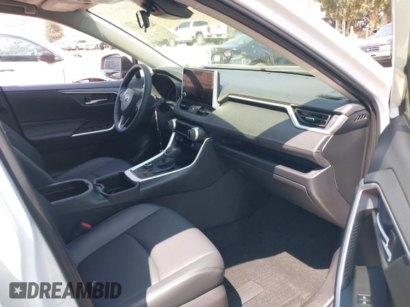 2024 Toyota RAV4 Hybrid XLE Premium with VIN JTMB6RFV9RJ063328, listed as a IAAI auction lot 42433233 with 9,874 mi miles and . Bid and sale history available at DreamBid. Image 5.
