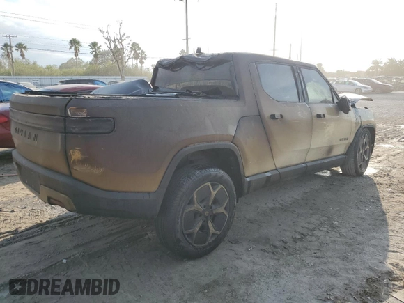 2023 Rivian R1T Adventure z VIN 7FCTGBAA6PN028517, wystawiony jako Copart lot #73712354 z przebiegiem Nie podano mil oraz Nie do naprawy. Historia ofert i sprzedaży dostępna na DreamBid. Obrazek 3.