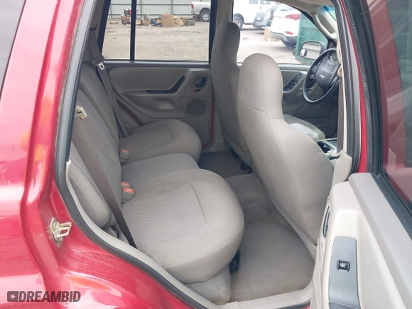 2004 Jeep Grand Cherokee Laredo with VIN 1J4GX48S14C259215, listed as a IAAI auction lot 41906121 with 142,668 mi miles. Bid and sale history available at carsss.com. Image 8.