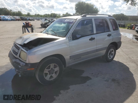 2003 Chevrolet Tracker with VIN 2CNBE13C836953178, listed as a Copart auction lot 60715605 with 128,978 mi miles and Salvage title. Bid and sale history available at DreamBid. Image 1.