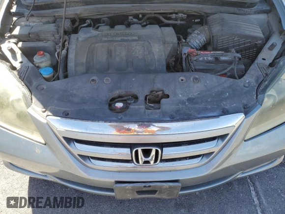 2005 Honda Odyssey Touring z VIN 5FNRL38805B131416, wystawiony jako Copart lot #59157395 z przebiegiem 263 087 mil mil oraz Szkoda całkowita • Salvage title. Historia ofert i sprzedaży dostępna na DreamBid. Obrazek 12.