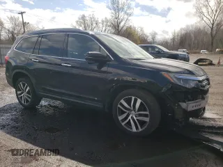 2017 Honda Pilot Touring with VIN 5FNYF6H90HB028112, listed as a Copart auction lot 52197645 with 218,944 mi miles and Salvage Title. Bid and sale history available at DreamBid. Image 4.