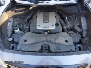 2015 Infiniti QX70 z VIN JN8CS1MW2FM481841, wystawiony jako Copart lot #41459505 z przebiegiem Nie podano mil oraz Szkoda całkowita • Salvage title. Historia ofert i sprzedaży dostępna na DreamBid. Obrazek 12.