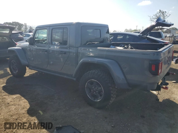 2023 Jeep Gladiator Rubicon with VIN 1C6JJTBG8PL550219, listed as a Copart auction lot 54627685 with 9,671 mi miles and Salvage title. Bid and sale history available at DreamBid. Image 2.