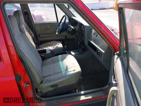 1996 Jeep Cherokee Sport with VIN 1J4FT68S0TL225719, listed as a IAAI auction lot 42121351 with 237,602 mi miles and . Bid and sale history available at DreamBid. Image 5.