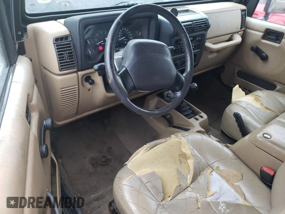 2000 Jeep Wrangler Sahara z VIN 1J4FA59S2YP714136, wystawiony jako Copart lot #57635845 z przebiegiem 178 075 mil mil oraz Czysty tytuł • Clean title. Historia ofert i sprzedaży dostępna na DreamBid. Obrazek 8.