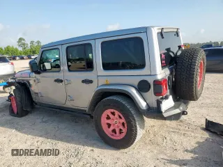 2021 Jeep Wrangler Unlimited Rubicon with VIN 1C4HJXFG0MW616829, listed as a Copart auction lot 61041425 with 128,724 mi miles and Salvage title. Bid and sale history available at DreamBid. Image 2.