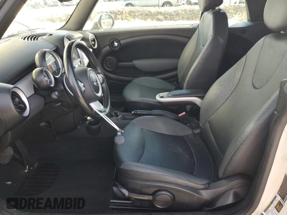 2010 MINI Convertible with VIN WMWMR3C55ATU97172, listed as a Copart auction lot 42726215 with 99,164 mi miles and Salvage Title. Bid and sale history available at DreamBid. Image 7.