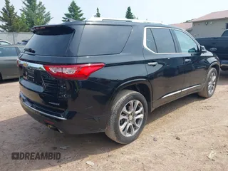 2019 Chevrolet Traverse Premier with VIN 1GNEVKKW1KJ282531, listed as a IAAI auction lot 42408361 with 95,464 mi miles and . Bid and sale history available at DreamBid. Image 4.