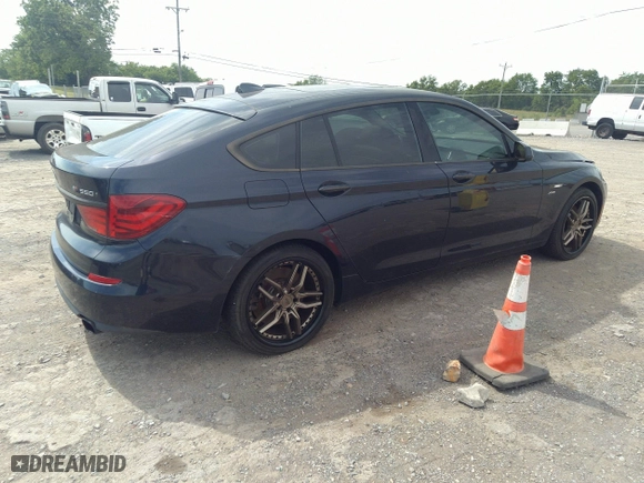 2012 BMW 5 Series Gran Turismo 550i xDrive with VIN WBASP4C53CC341928, listed as a IAAI auction lot 36580839 with 93,808 mi miles. Bid and sale history available at carsss.com. Image 4.