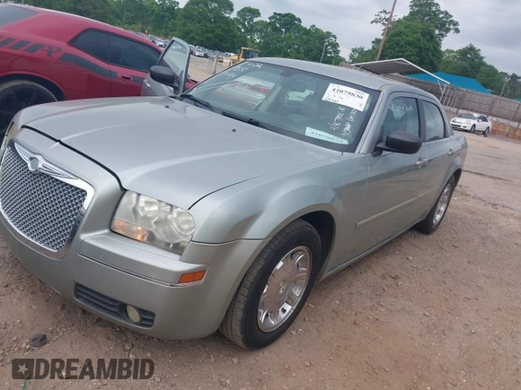 2006 Chrysler 300 Touring with VIN 2C3KA53G06H164188, listed as a IAAI auction lot 42079830 with 165,321 mi miles. Bid and sale history available at carsss.com. Image 2.