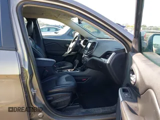 2017 Jeep Cherokee Trailhawk L Plus with VIN 1C4PJMBB6HW654172, listed as a IAAI auction lot 41851236 with 104,263 mi miles. Bid and sale history available at carsss.com. Image 5.