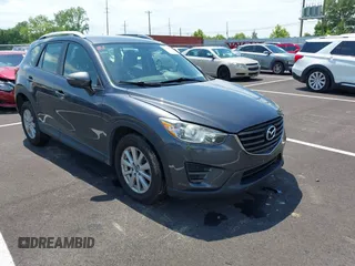 2016 Mazda CX-5 Sport z VIN JM3KE4BY4G0783619, wystawiony jako IAAI lot #42368512 z przebiegiem 115 694 mil mil oraz . Historia ofert i sprzedaży dostępna na DreamBid. Obrazek 1.
