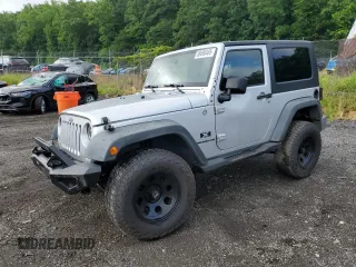 2007 Jeep Wrangler X z VIN 1J4FA24117L202404, wystawiony jako Copart lot #58690485 z przebiegiem 126 347 mil mil oraz Szkoda całkowita • Salvage title. Historia ofert i sprzedaży dostępna na DreamBid. Obrazek 1.