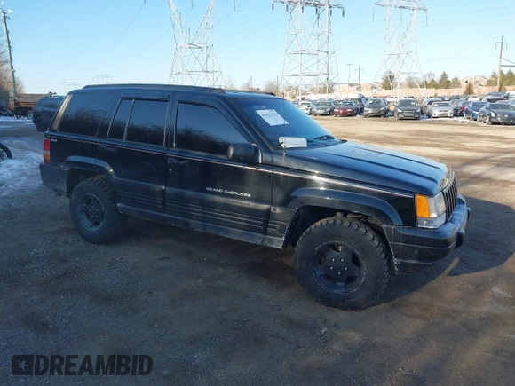 1996 Jeep Grand Cherokee Laredo with VIN 1J4GZ58S3TC197587, listed as a IAAI auction lot 41423318 with 200,116 mi miles. Bid and sale history available at carsss.com. Image 1.