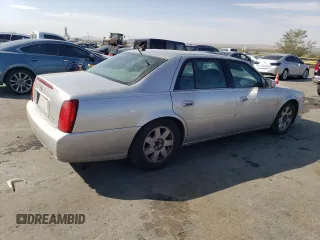 2004 Cadillac DeVille DTS z VIN 1G6KF57994U203706, wystawiony jako Copart lot #76278324 z przebiegiem 203 709 mil mil oraz Szkoda całkowita • Salvage title. Historia ofert i sprzedaży dostępna na DreamBid. Obrazek 3.