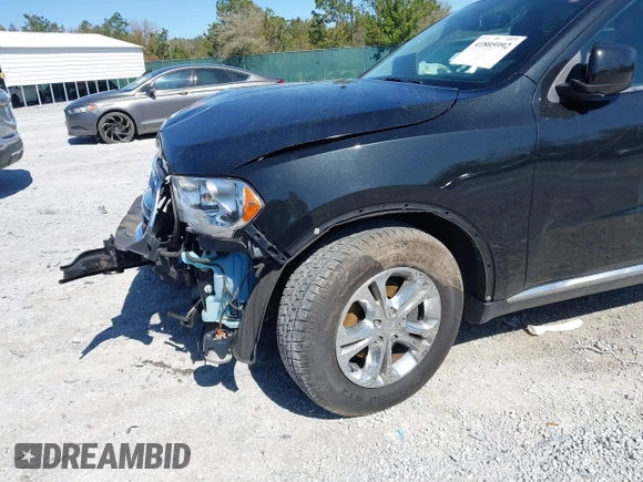 2013 Dodge Durango SXT with VIN 1C4RDJAG2DC617983, listed as a IAAI auction lot 41805992 with 210,560 mi miles and . Bid and sale history available at carsss.com. Image 6.