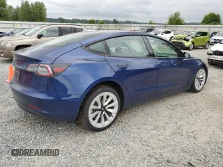 2023 Tesla Model 3 with VIN 5YJ3E1EA7PF450973, listed as a Copart auction lot 61082175 with 47,029 mi miles and Salvage title. Bid and sale history available at DreamBid. Image 3.