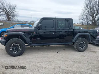 2022 Jeep Gladiator Rubicon with VIN 1C6JJTBG7NL145501, listed as a IAAI auction lot 41506842 with 20,593 mi miles and . Bid and sale history available at DreamBid. Image 14.