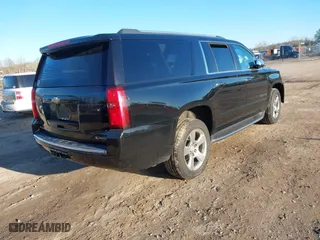 2017 Chevrolet Suburban Premier with VIN 1GNSCJKC6HR181388, listed as a IAAI auction lot 41806012 with 170,916 mi miles. Bid and sale history available at carsss.com. Image 4.