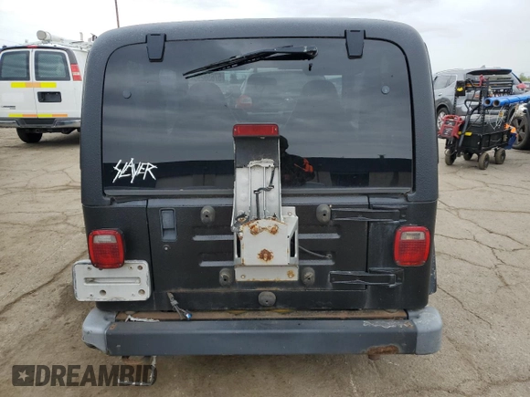 2002 Jeep Wrangler Sport z VIN 1J4FA49S22P763189, wystawiony jako Copart lot #57650295 z przebiegiem 197 383 mil mil oraz Czysty tytuł • Clean title. Historia ofert i sprzedaży dostępna na DreamBid. Obrazek 6.