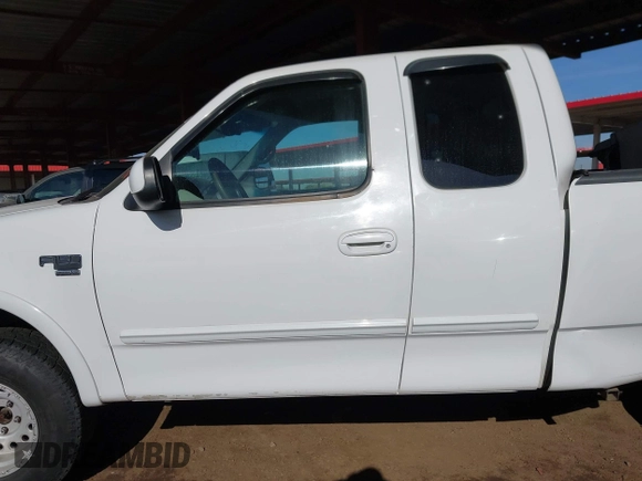 1999 Ford F-150 XL with VIN 2FTRX18L9XCA21004, listed as a IAAI auction lot 41616300 with 186,620 mi miles. Bid and sale history available at carsss.com. Image 14.