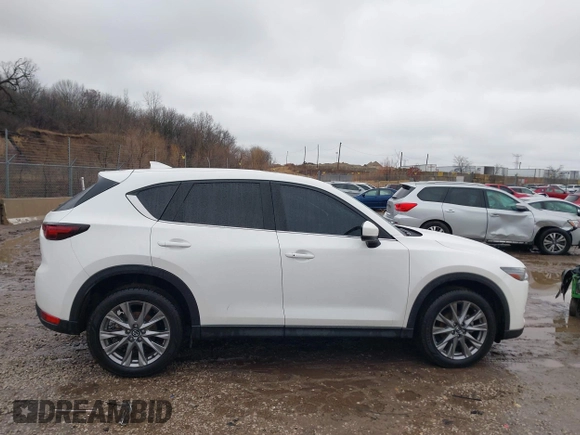 2021 Mazda CX-5 Grand Touring with VIN JM3KFADM4M1340141, listed as a IAAI auction lot 41194711 with 37,887 mi miles. Bid and sale history available at carsss.com. Image 13.