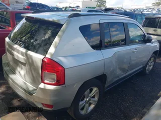 2011 Jeep Compass with VIN 1J4NT1FA1BD260206, listed as a IAAI auction lot 41917357 with 156,168 mi miles. Bid and sale history available at carsss.com. Image 4.
