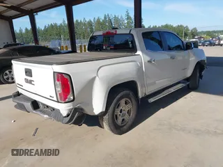 2015 GMC Canyon 2WD SLE with VIN 1GTG5CEA1F1273955, listed as a IAAI auction lot 42392908 with 79,981 mi miles and . Bid and sale history available at DreamBid. Image 4.