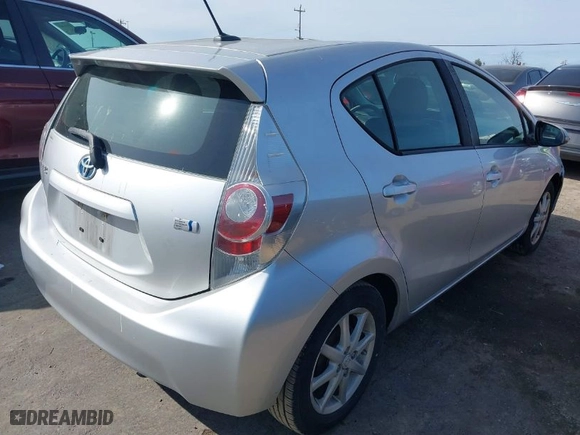 2013 Toyota Prius c One with VIN JTDKDTB3XD1534662, listed as a IAAI auction lot 41859938 with 136,151 mi miles. Bid and sale history available at carsss.com. Image 4.