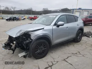 2020 Mazda CX-5 Touring z VIN JM3KFBCM2L0768348, wystawiony jako Copart lot #87813065 z przebiegiem Nie podano mil oraz Szkody całkowita. Historia ofert i sprzedaży dostępna na DreamBid. Obrazek 1.