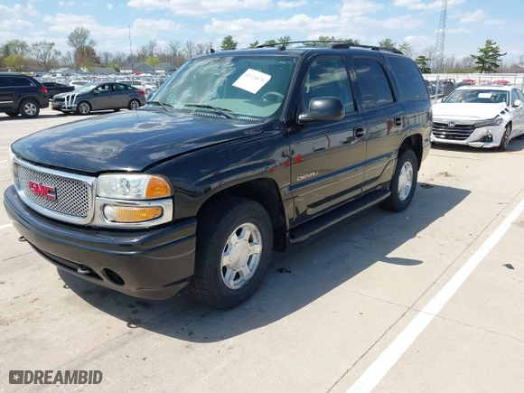 2004 GMC Yukon Denali with VIN 1GKEK63U54J308934, listed as a IAAI auction lot 42124676 with 254,362 mi miles. Bid and sale history available at carsss.com. Image 2.