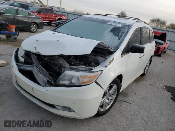 2012 Honda Odyssey Touring with VIN 5FNRL5H91CB047042, listed as a Copart auction lot 82248004 with 123,445 mi miles and Salvage Title. Bid and sale history available at carsss.com. Image 1.