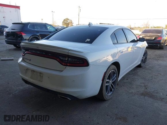 2019 Dodge Charger SXT with VIN 2C3CDXJG1KH533323, listed as a IAAI auction lot 41369282 with 102,467 mi miles and . Bid and sale history available at DreamBid. Image 4.