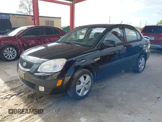 2009 Kia Rio LX with VIN KNADE223496561265, listed as a IAAI auction lot 42143889 with 235,634 mi miles and . Bid and sale history available at DreamBid. Image 2.