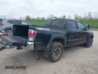 2023 Toyota Tacoma SR with VIN 3TMCZ5AN2PM598464, listed as a IAAI auction lot 42238032 with 35,597 mi miles and . Bid and sale history available at DreamBid. Image 4.