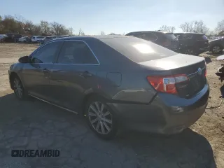 2013 Toyota Camry L with VIN 4T4BF1FK7DR285575, listed as a Copart auction lot 82877124 with 102,946 mi miles and Salvage Title. Bid and sale history available at carsss.com. Image 2.